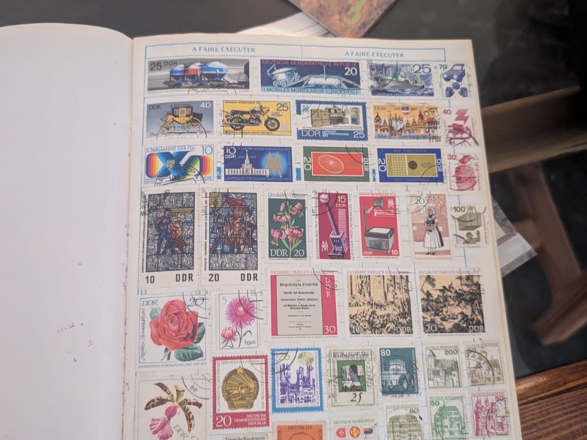 Open album of vintage postage stamps from the archive